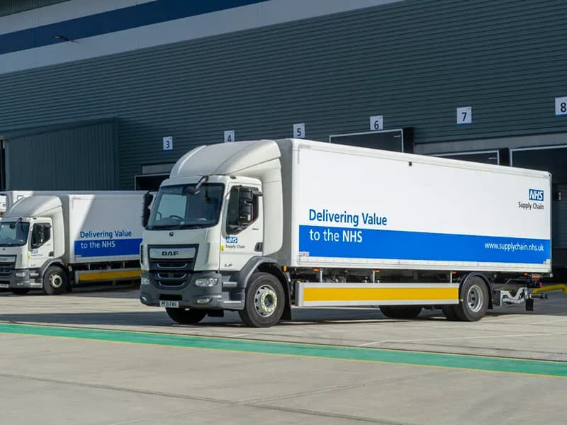 NHS Supply Chain DAF trucks at a distribution centre from Dynamon ZERO electrification case study in Wales