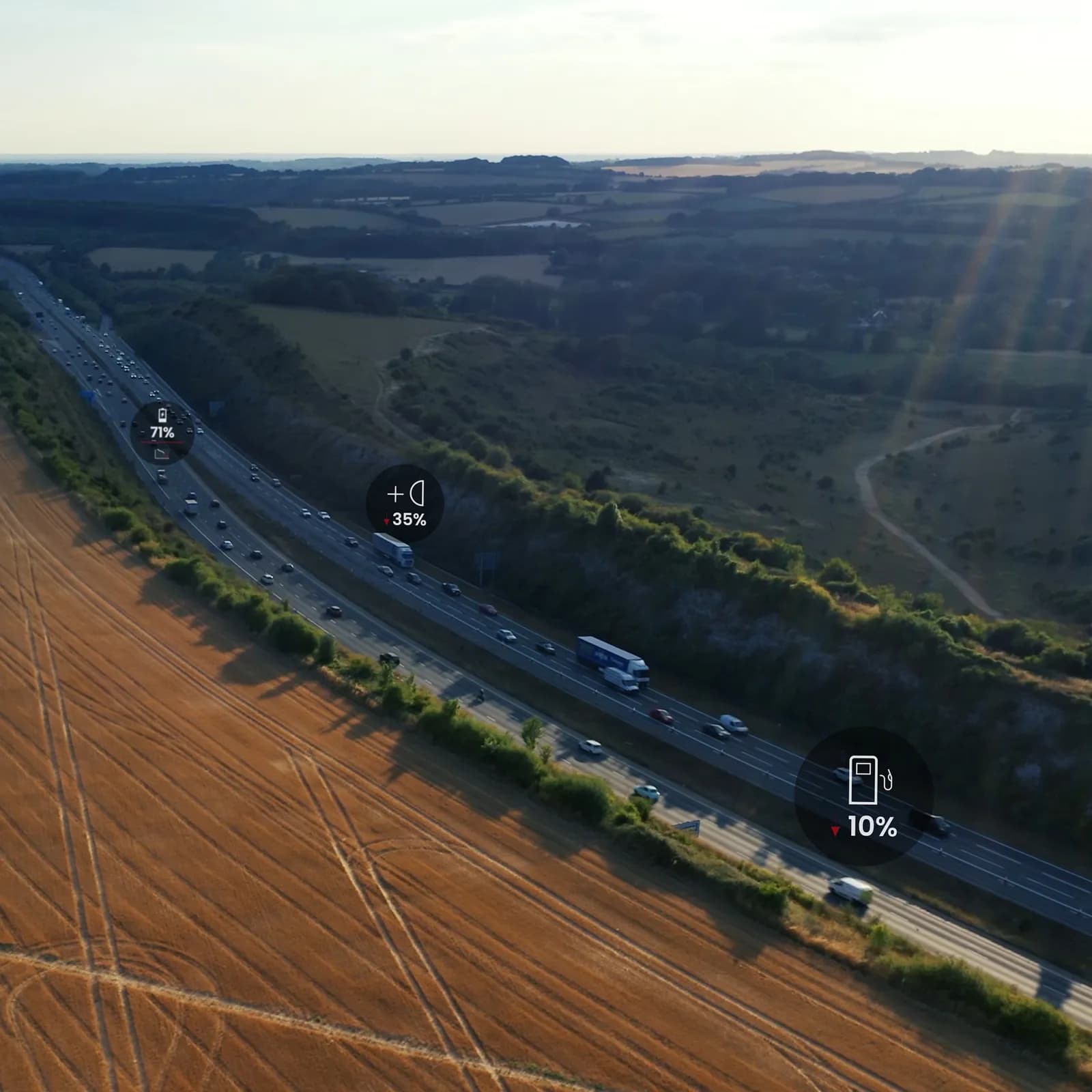 Aerial shot of a motorway with HGVs analysed by software overlays on each vehicle