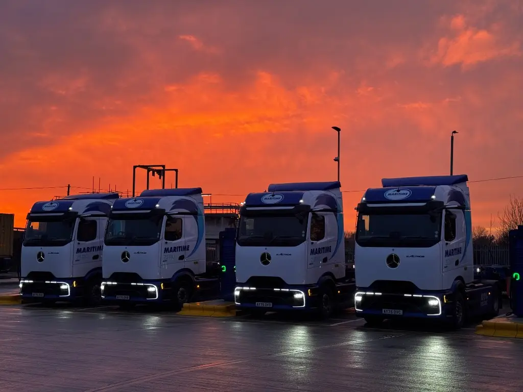 Maritime Transport Mercedes-Benz eActros electric HGVs at a charging depot at dusk from Dynamon ZERO and RouteZERO case study