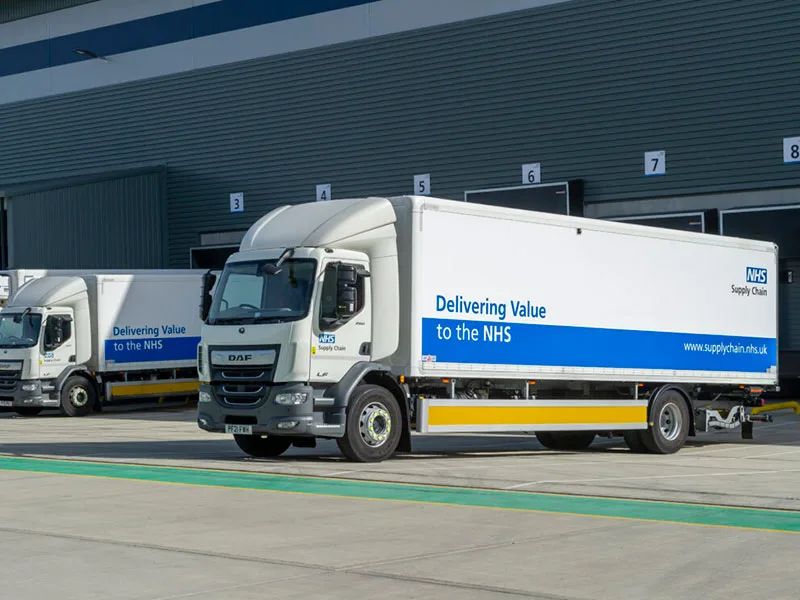 NHS Supply Chain DAF trucks at a distribution centre from Dynamon ZERO electrification case study in Wales